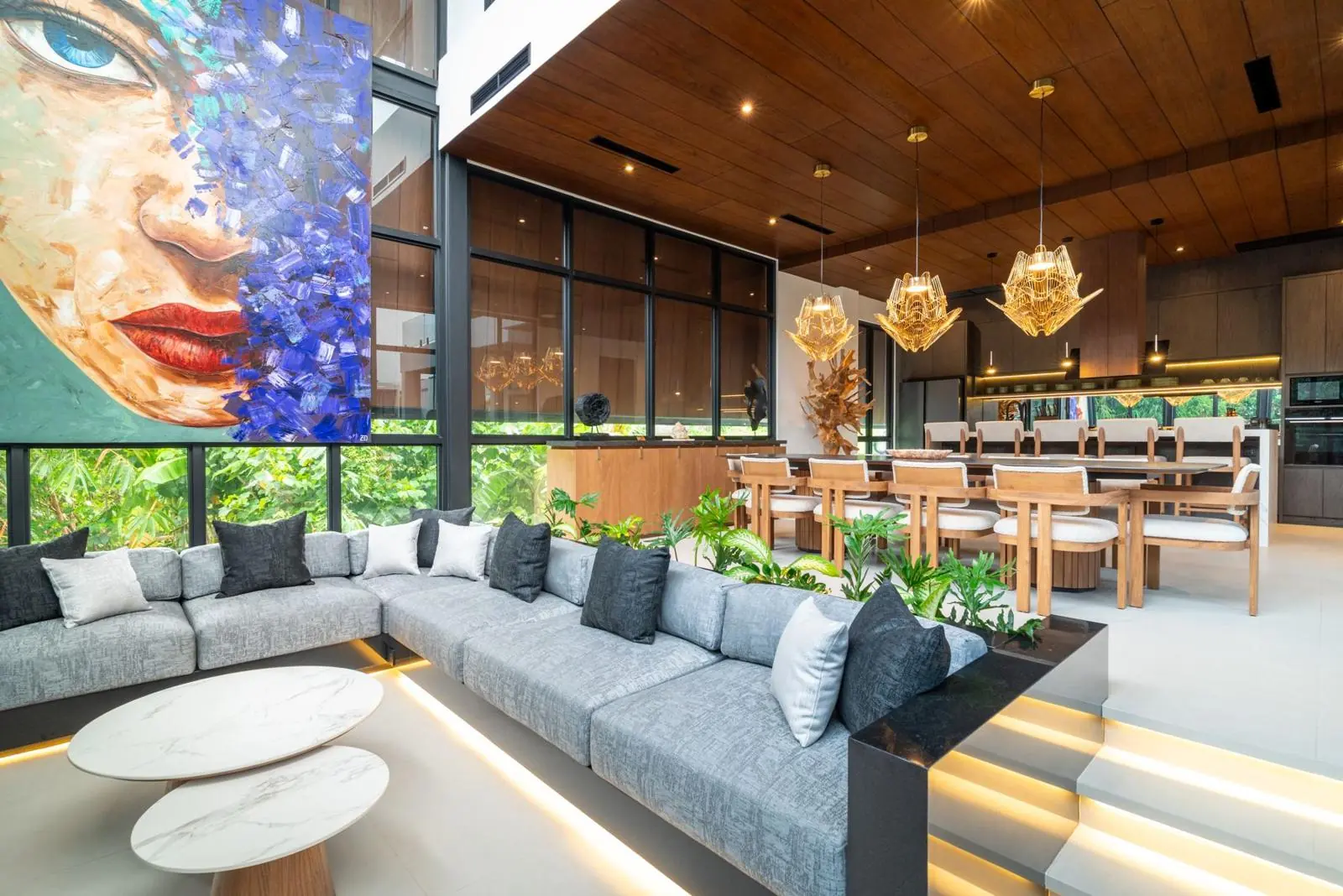 Double-height living room with original art and golden pendants MAR Bali 2 luxury villa Pererenan Bali
